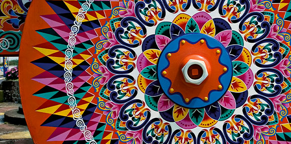 A colorful umbrella with a decorative design on it.