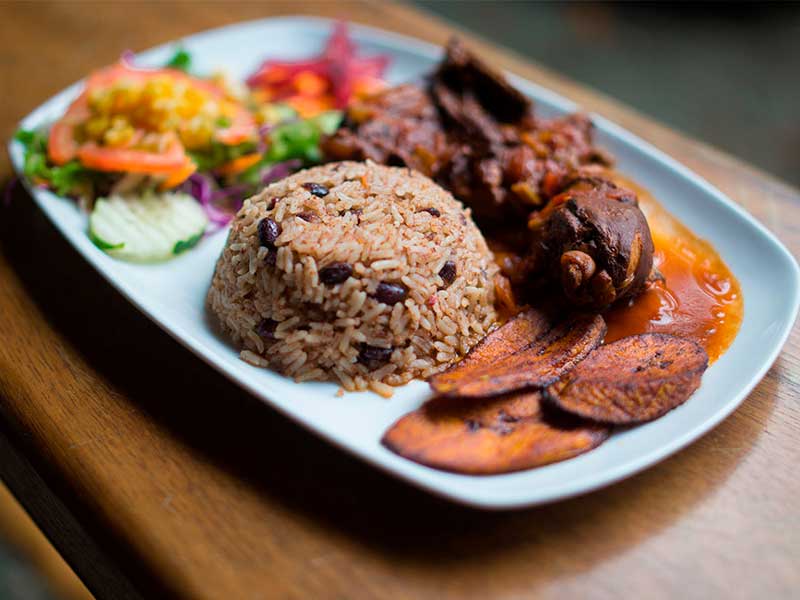 Rice and beans with chicken and salad.