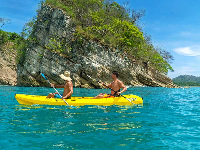 A couple of people that are in a kayak.