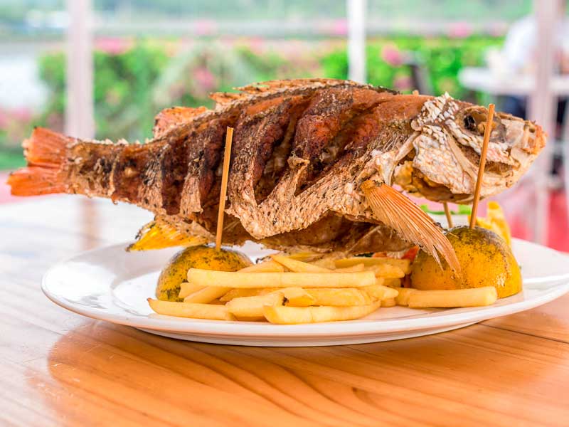 A plate of food on a wooden table.