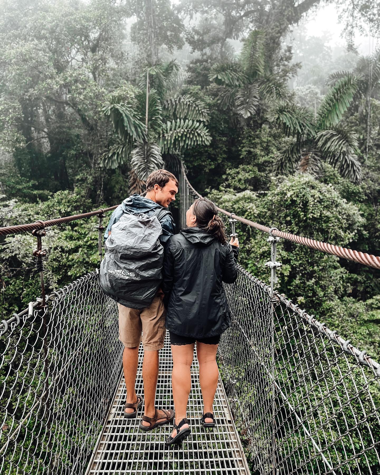 A couple walking in the hanging bridge