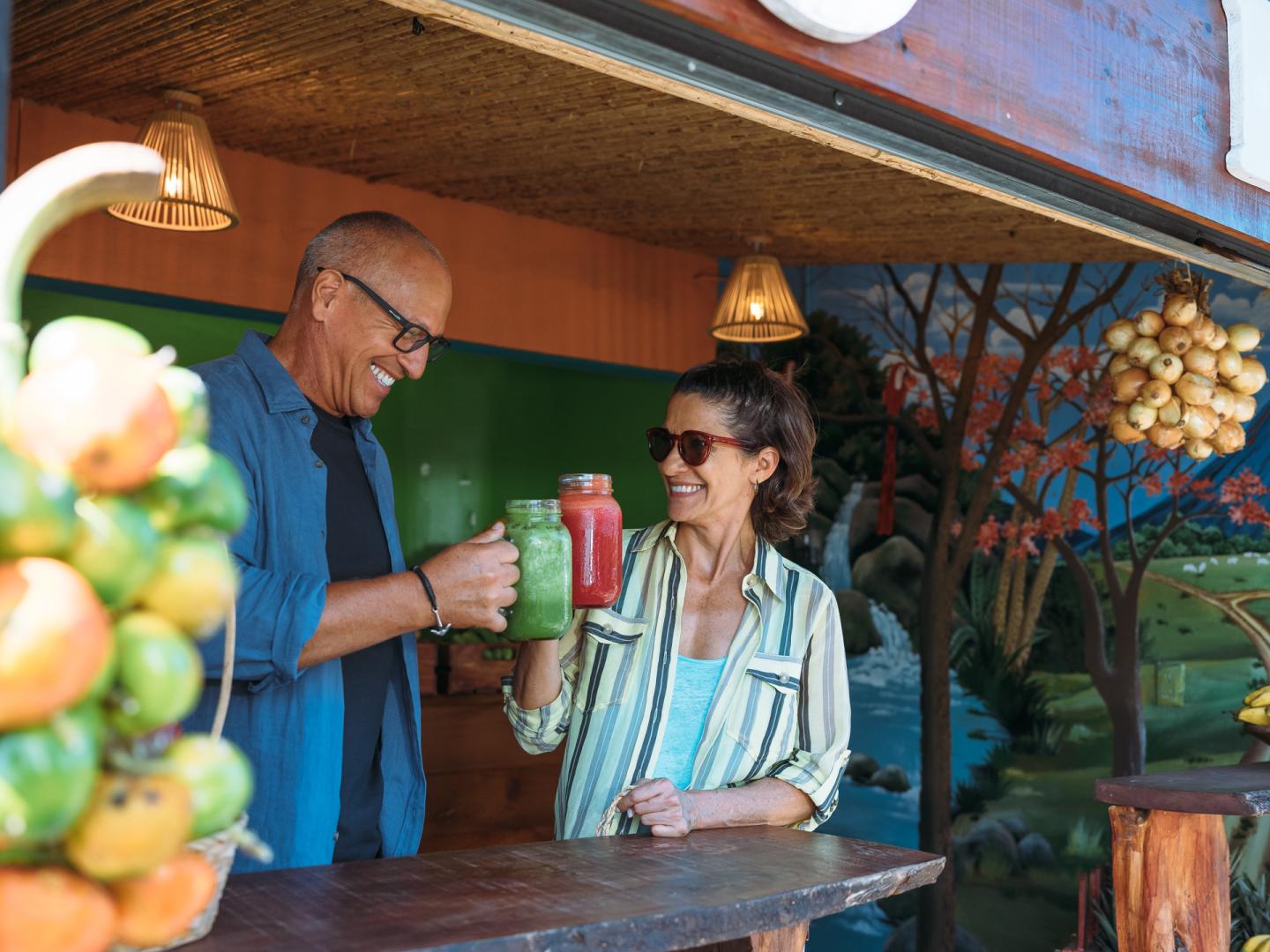 couple having frozen drinks at bar