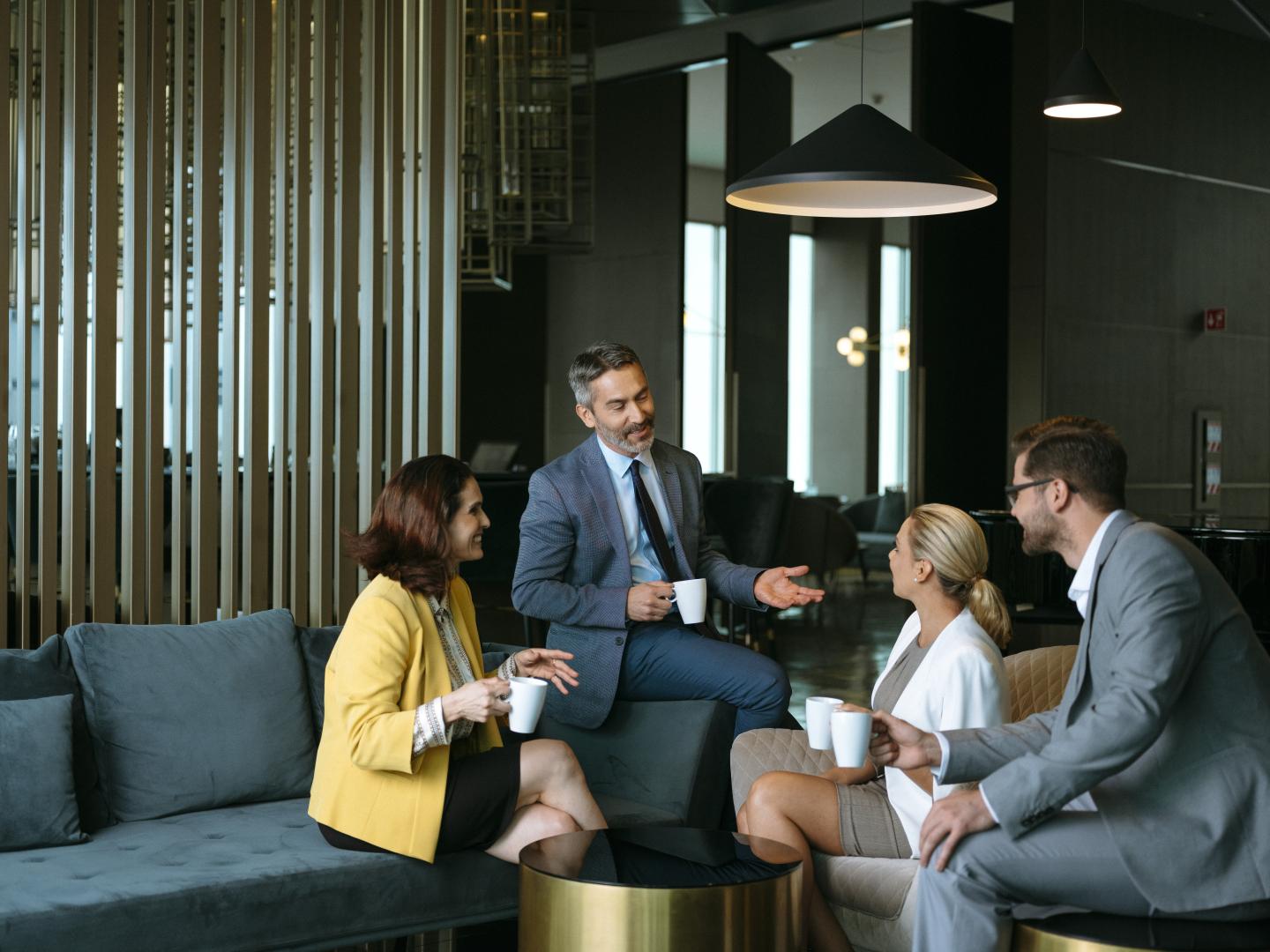 group of professionals talking with coffee