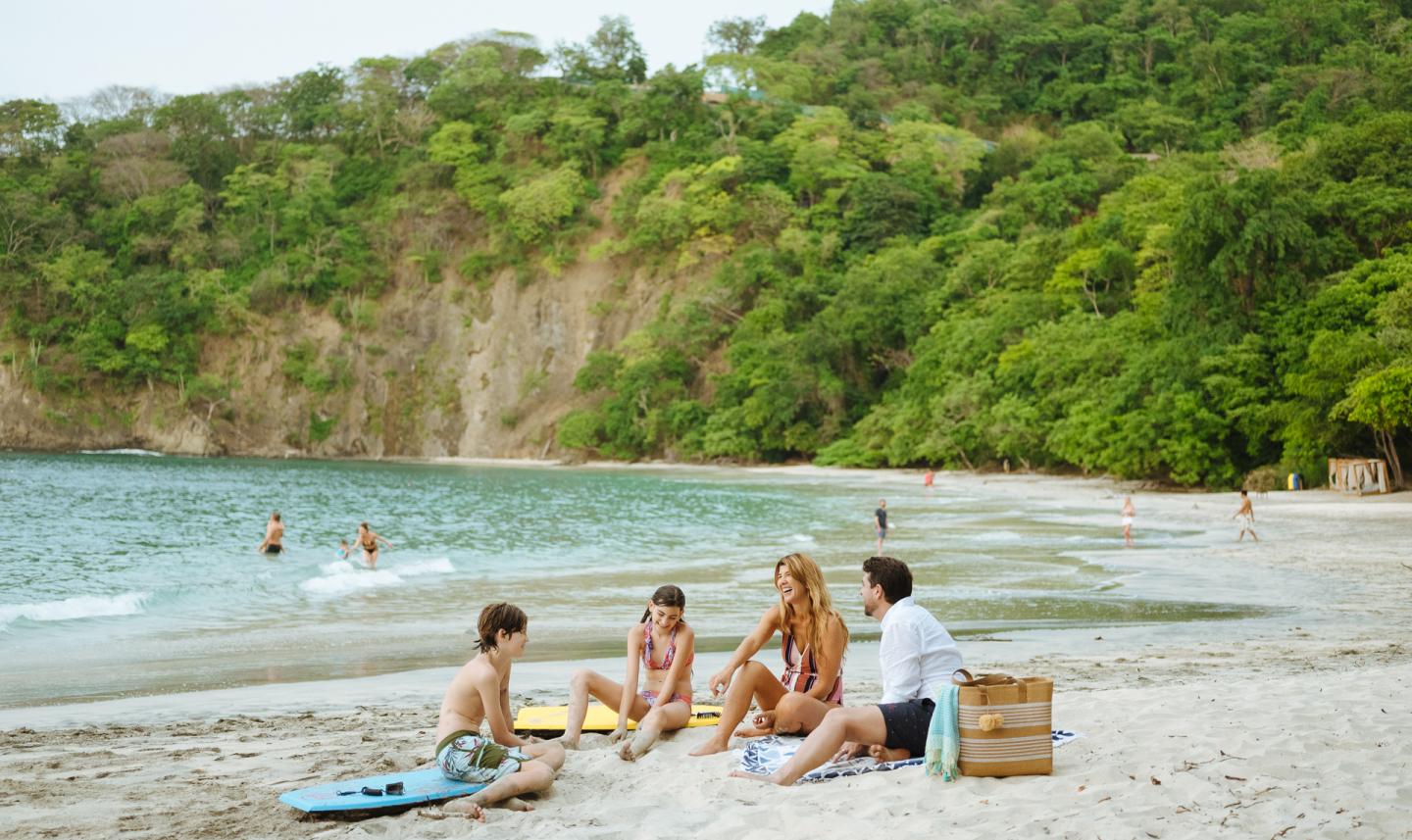 family having a picnic on a beach