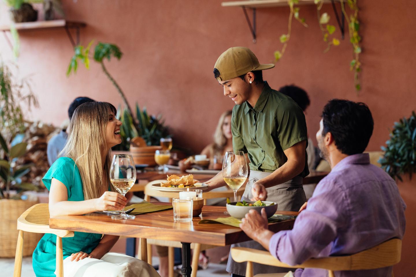 couple at a diner being served food