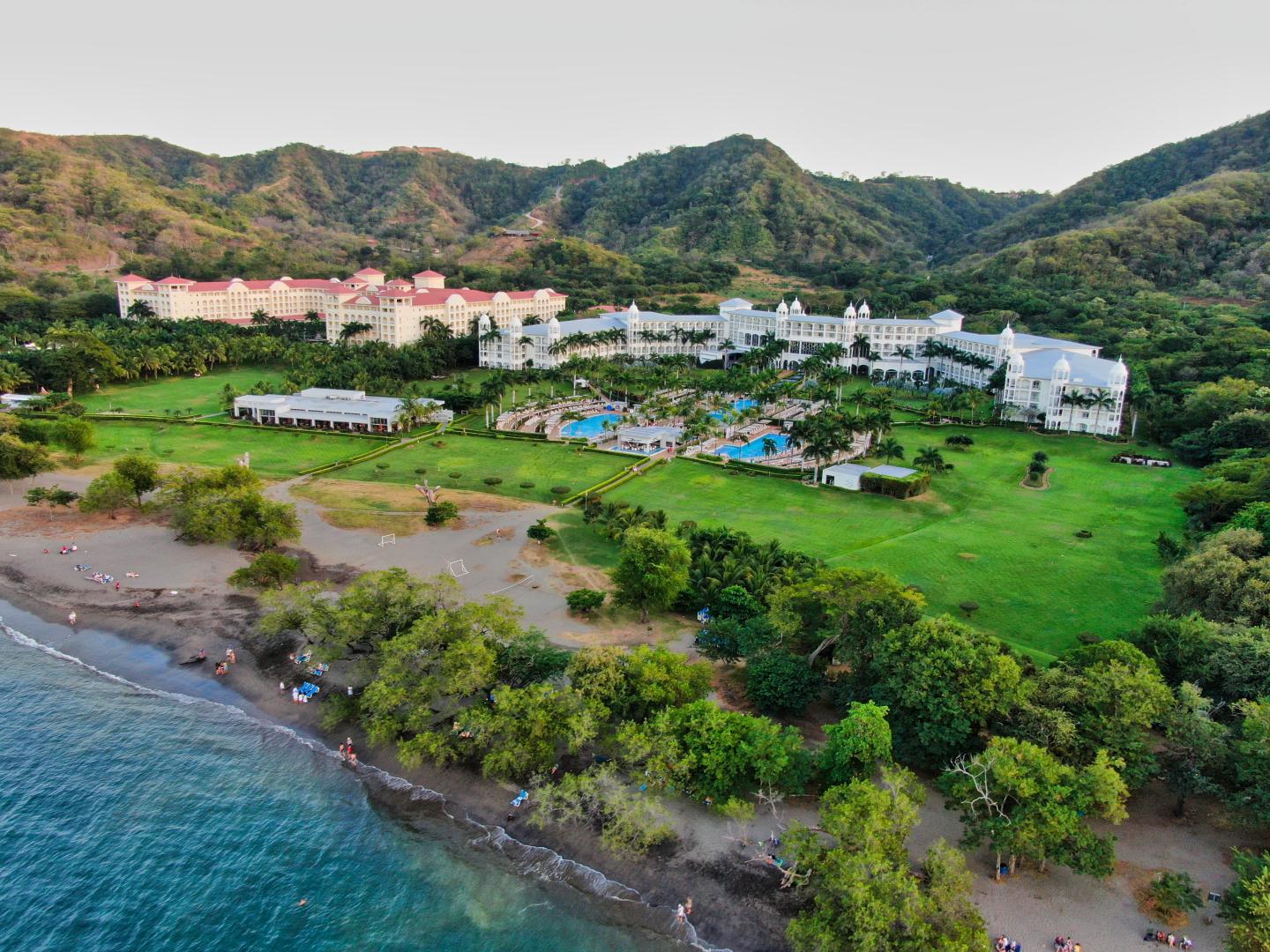 Aerial view of all inclusive hotel next to ocean