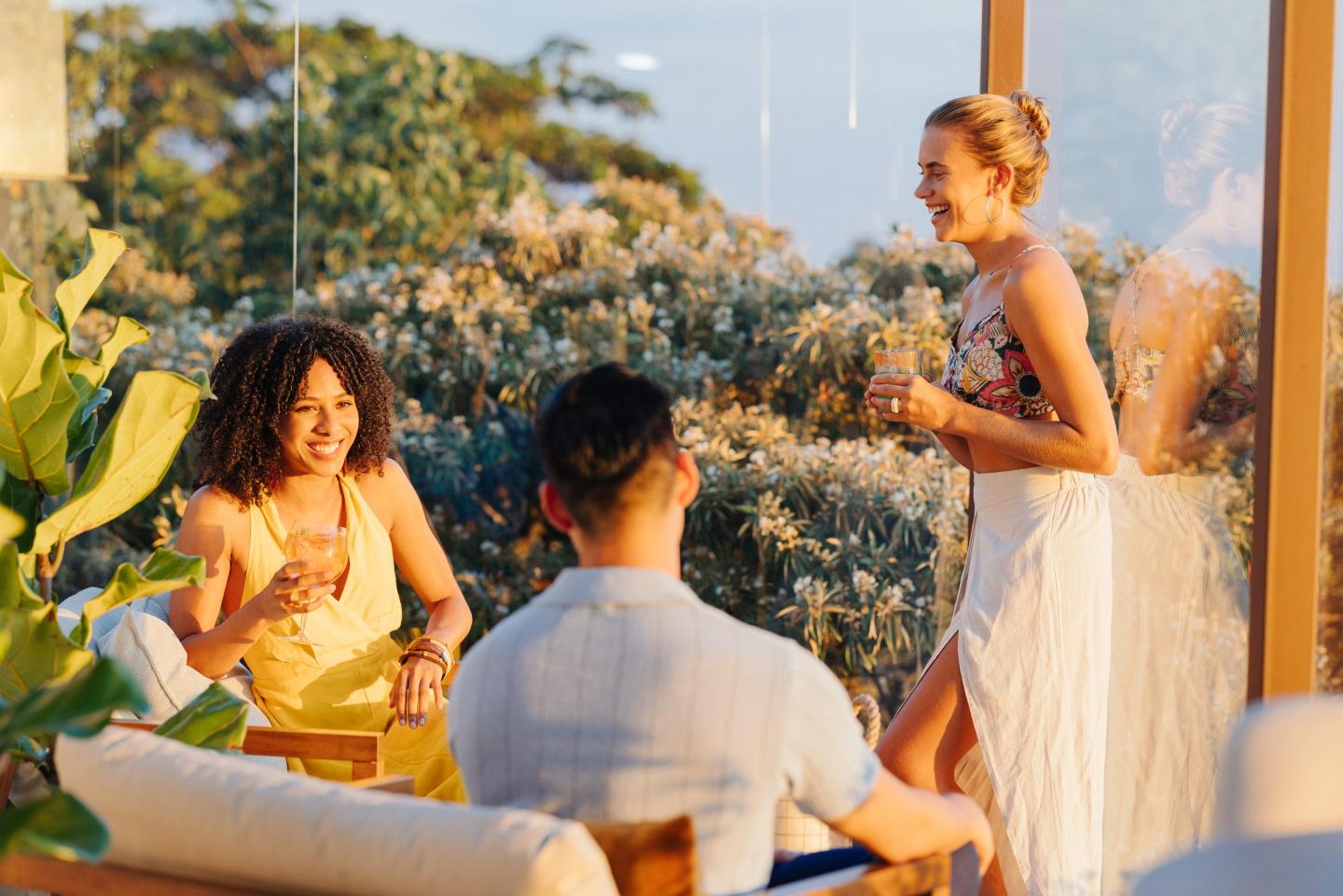 Friends with drinks at San Lucas Treetop Dining in Monteverde