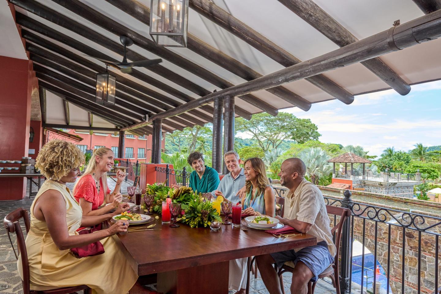 Guests chatting at a lunch table at Los Sueños Marriott in Puntarenas